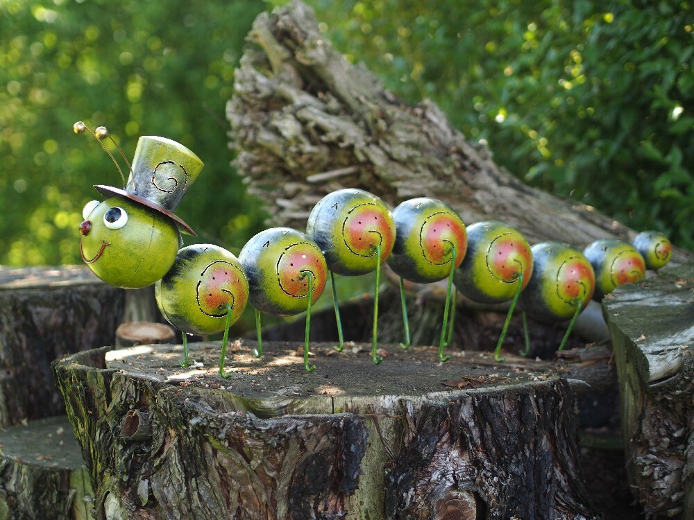 Caterpillar with Hat – Iron Sculpture. 75x15x30cm