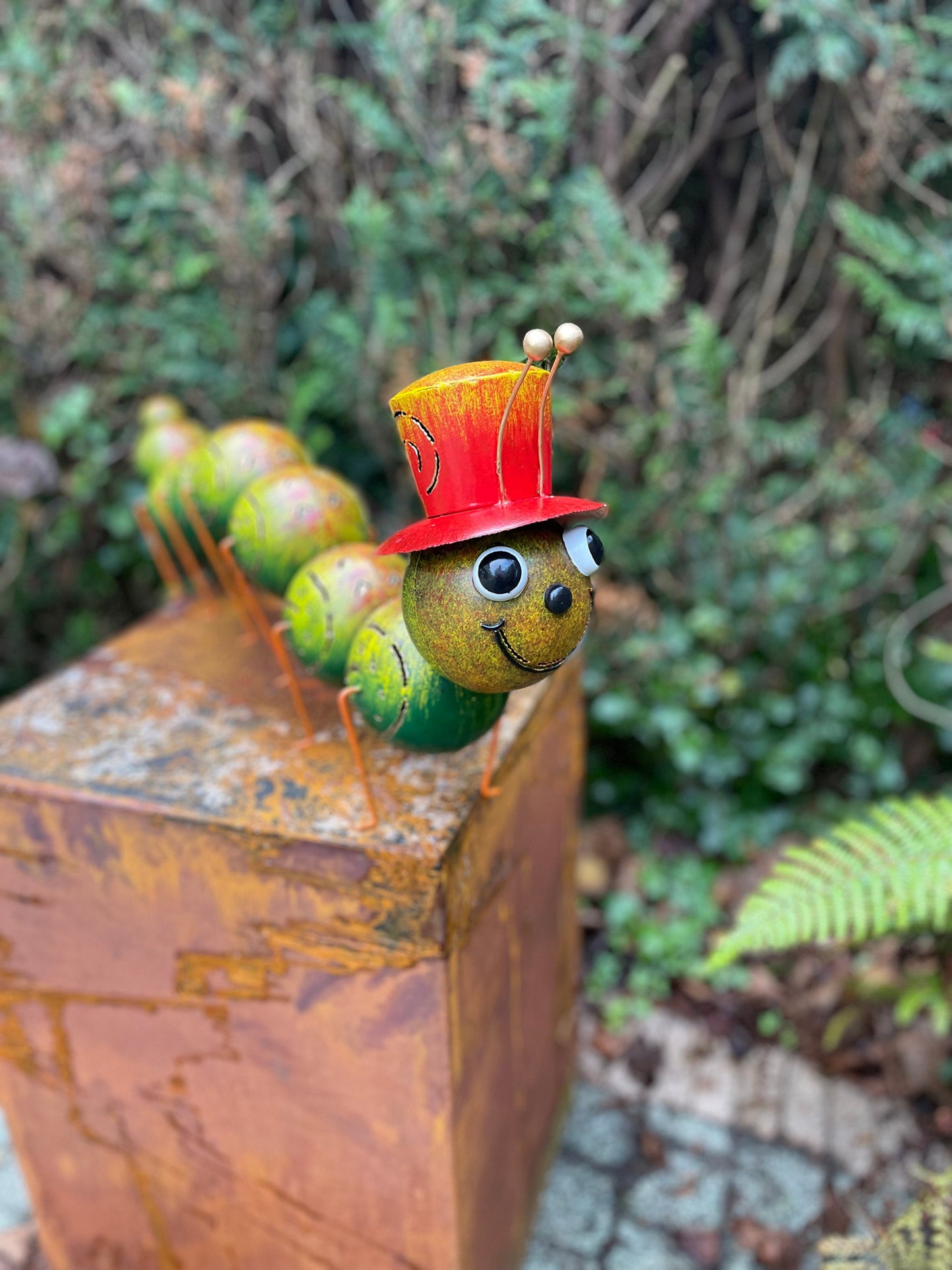 Caterpillar with Hat – Iron Sculpture. 75x15x30cm