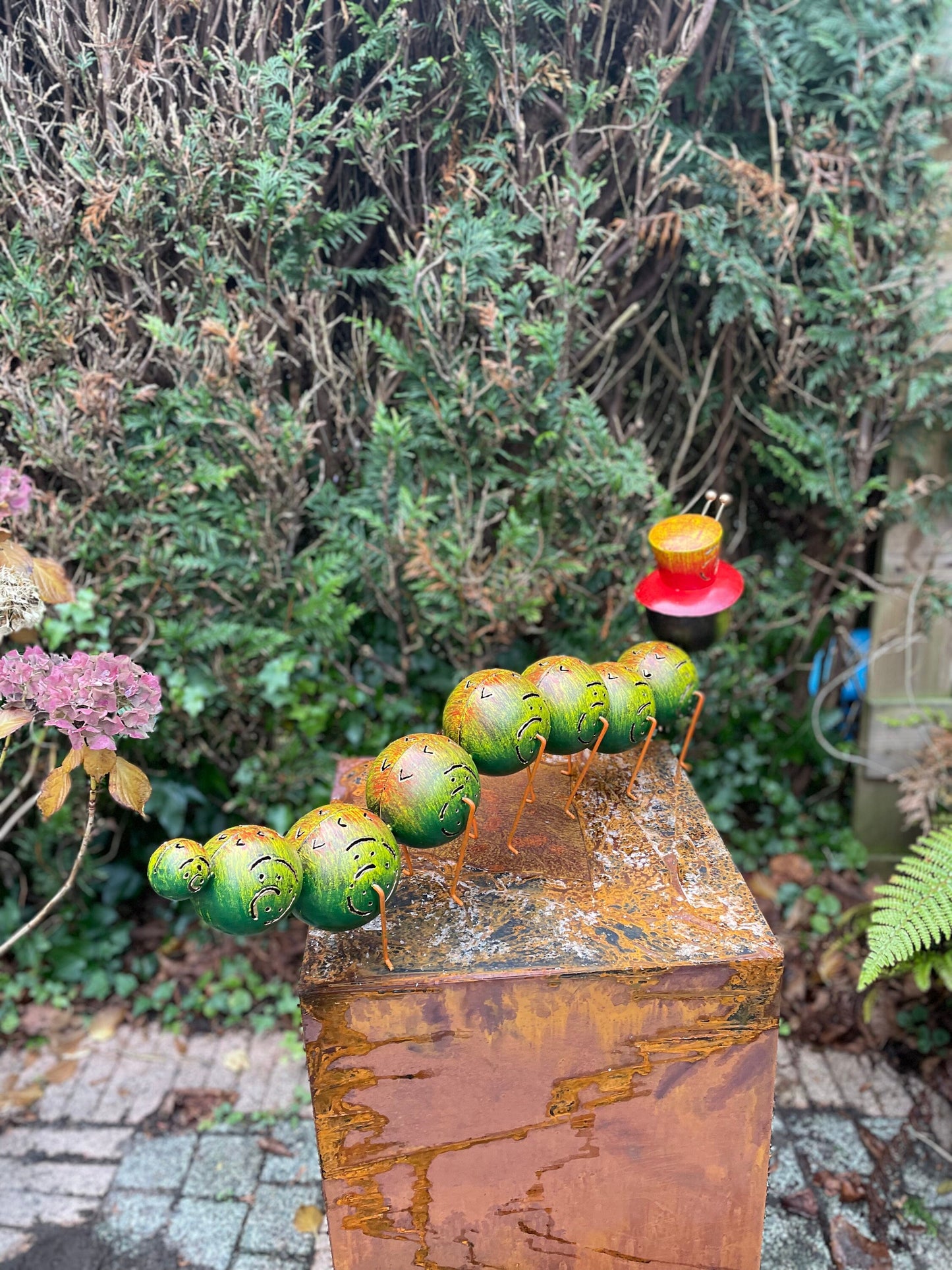 Caterpillar with Hat – Iron Sculpture. 75x15x30cm