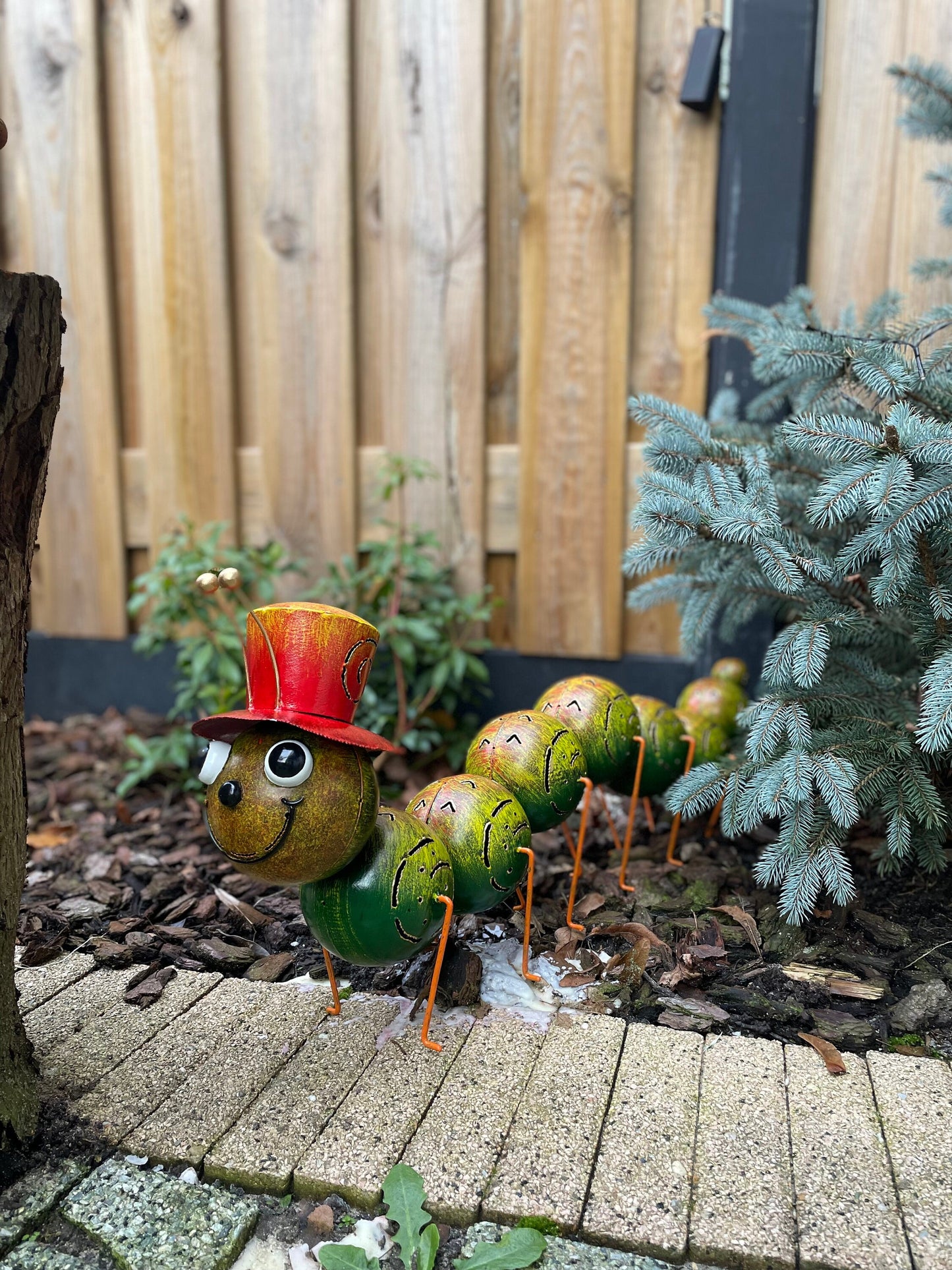 Caterpillar with Hat – Iron Sculpture. 75x15x30cm