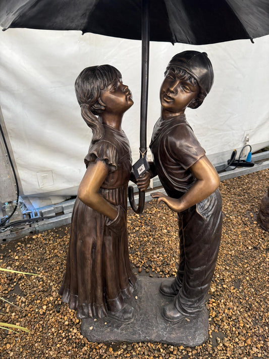 Under the Umbrella – Bronze Sculpture. 91x90x138cm