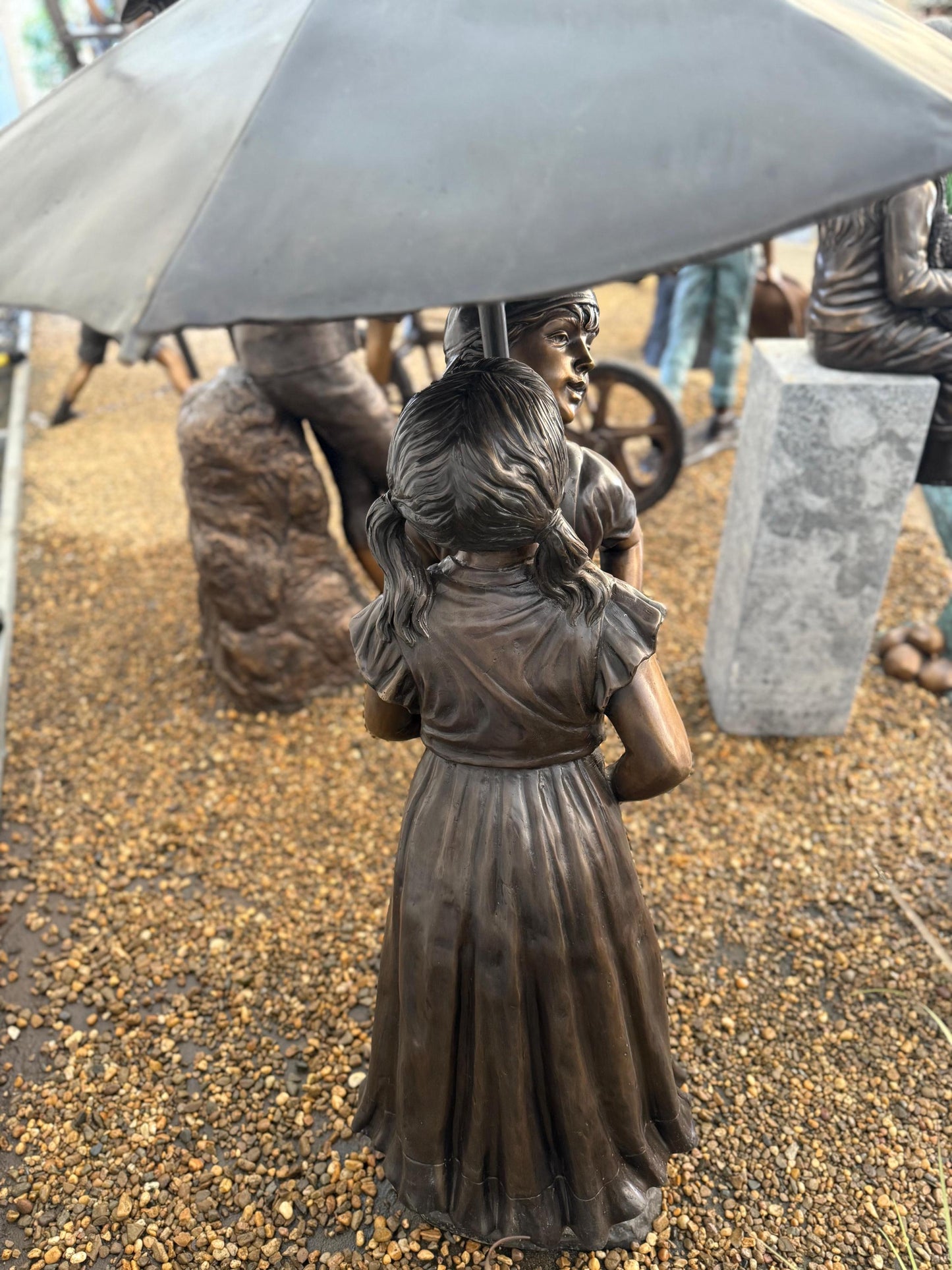 Under the Umbrella – Bronze Sculpture. 91x90x138cm